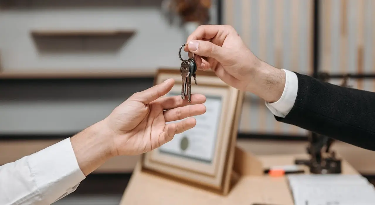 Agents handing over keys